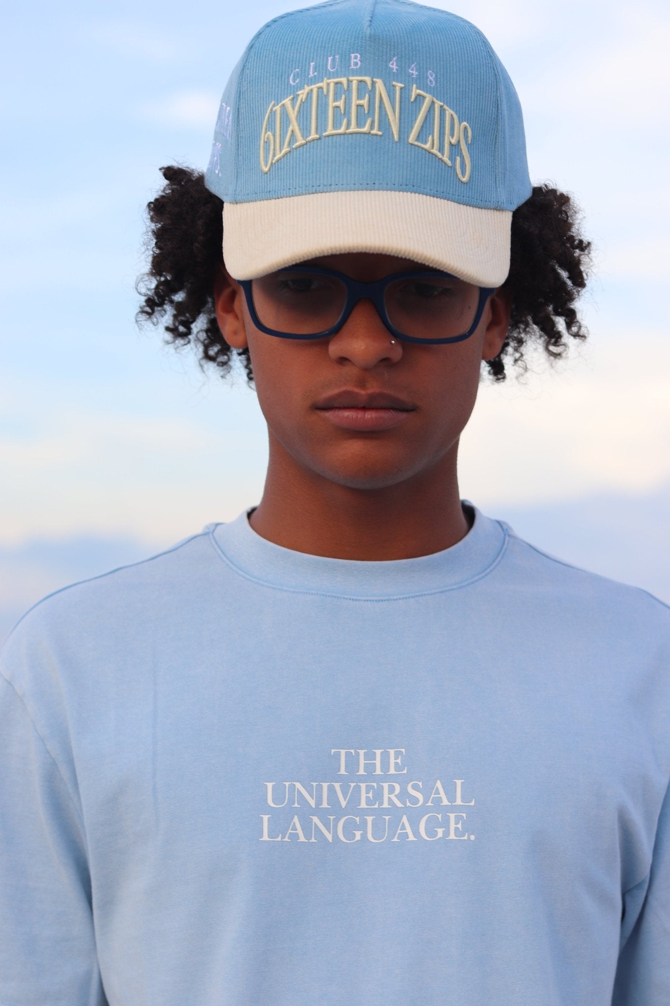 "The Universal Language" Sky Blue Acid Washed Boxy T-shirt - 6IXTEEN Zips